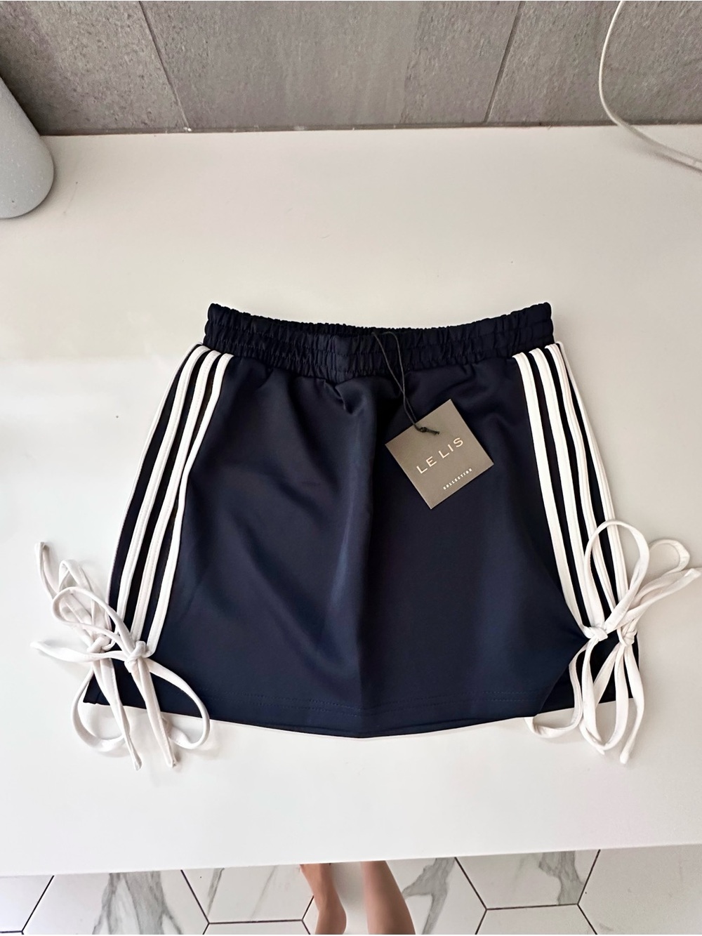 Le Lis Navy Athletic Skirt with White Side Stripes and Tie Sides